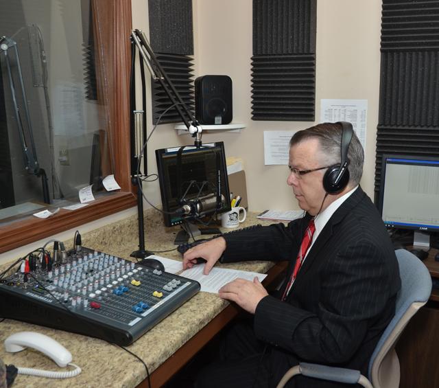 John Chowning, host of "Dialogue on Public Issues" on WLCU, prepares to interview United  States Congressman Brett Guthrie, a Republican representing  the Kentucky Second Congressional District, on the phone. The show will be aired on WLCU-FM  88.7 on Monday, Dec. 24, Wednesday, Dec. 26 and Friday, Dec. 28 at 6 p.m. Chowning is vice president for church and external relations and executive assistant to the president at Campbellsville University. (Campbellsville University Photo by Joan C. McKinney)